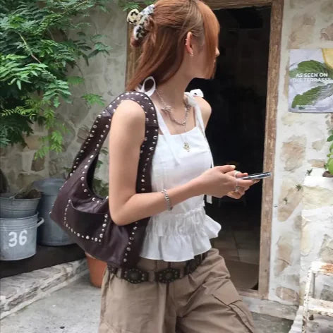Why Are Handbags Moving Back Under the Arm?