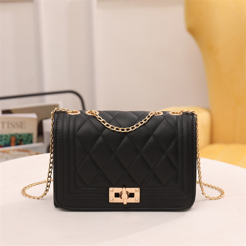 Chic Quilted Crossbody Bag in Black with Gold Chain Strap Main image